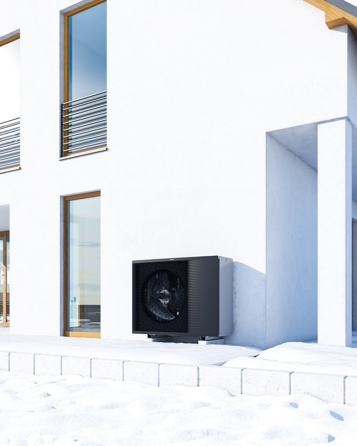 DAIKIN Altherma 3 H HT vonkajšia jednotka 16 kW EPRA16DW17 — vonkajšia jednotka pri terase domu v zime